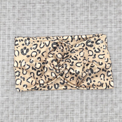 tan headband with black cheetah print