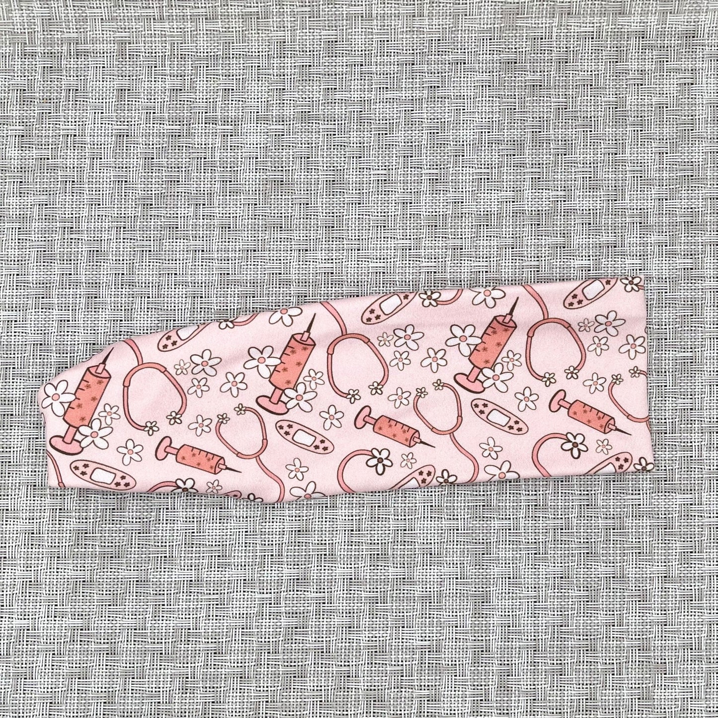 pink headband with medical theme print and flowers