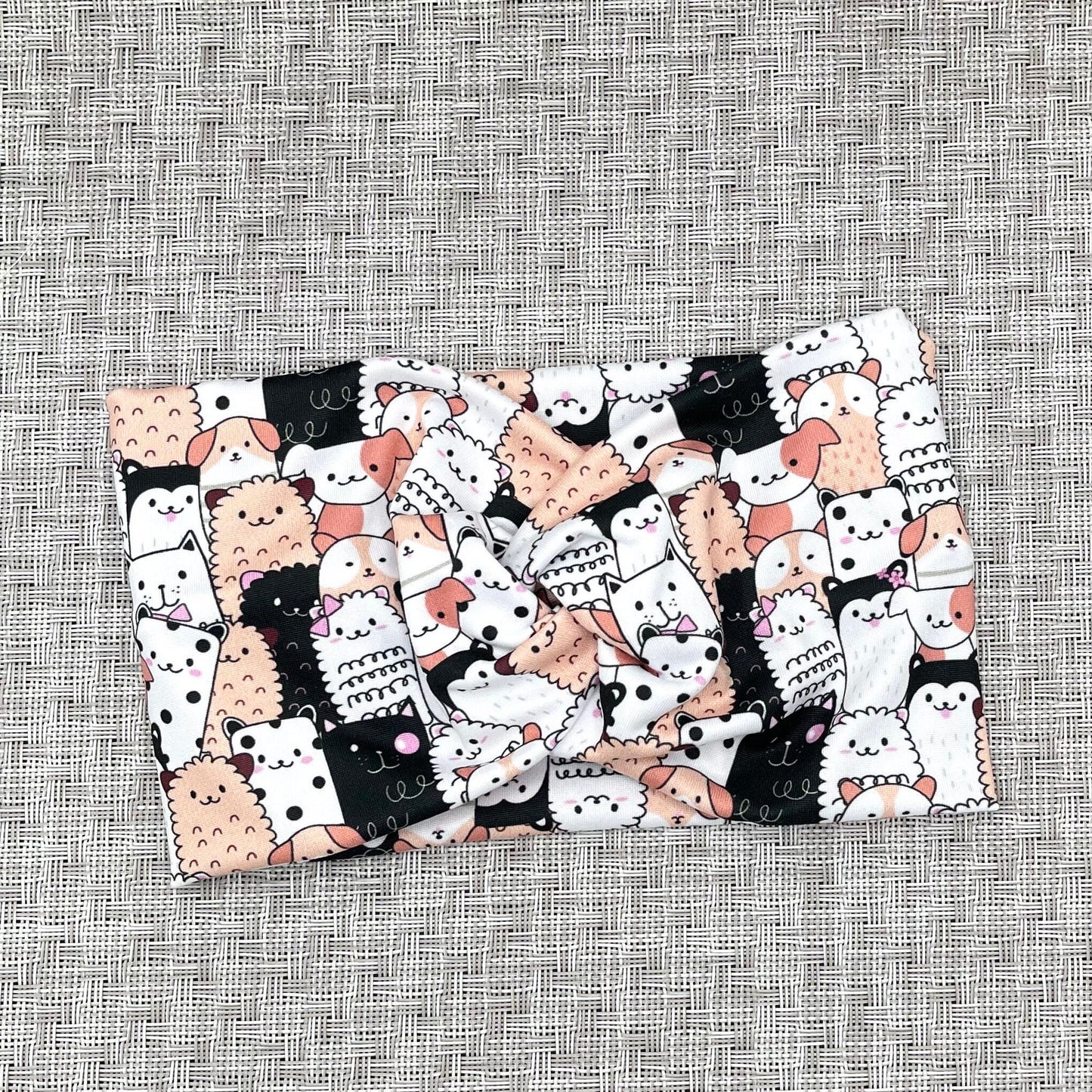 white, black, and peach headband with cats and dogs