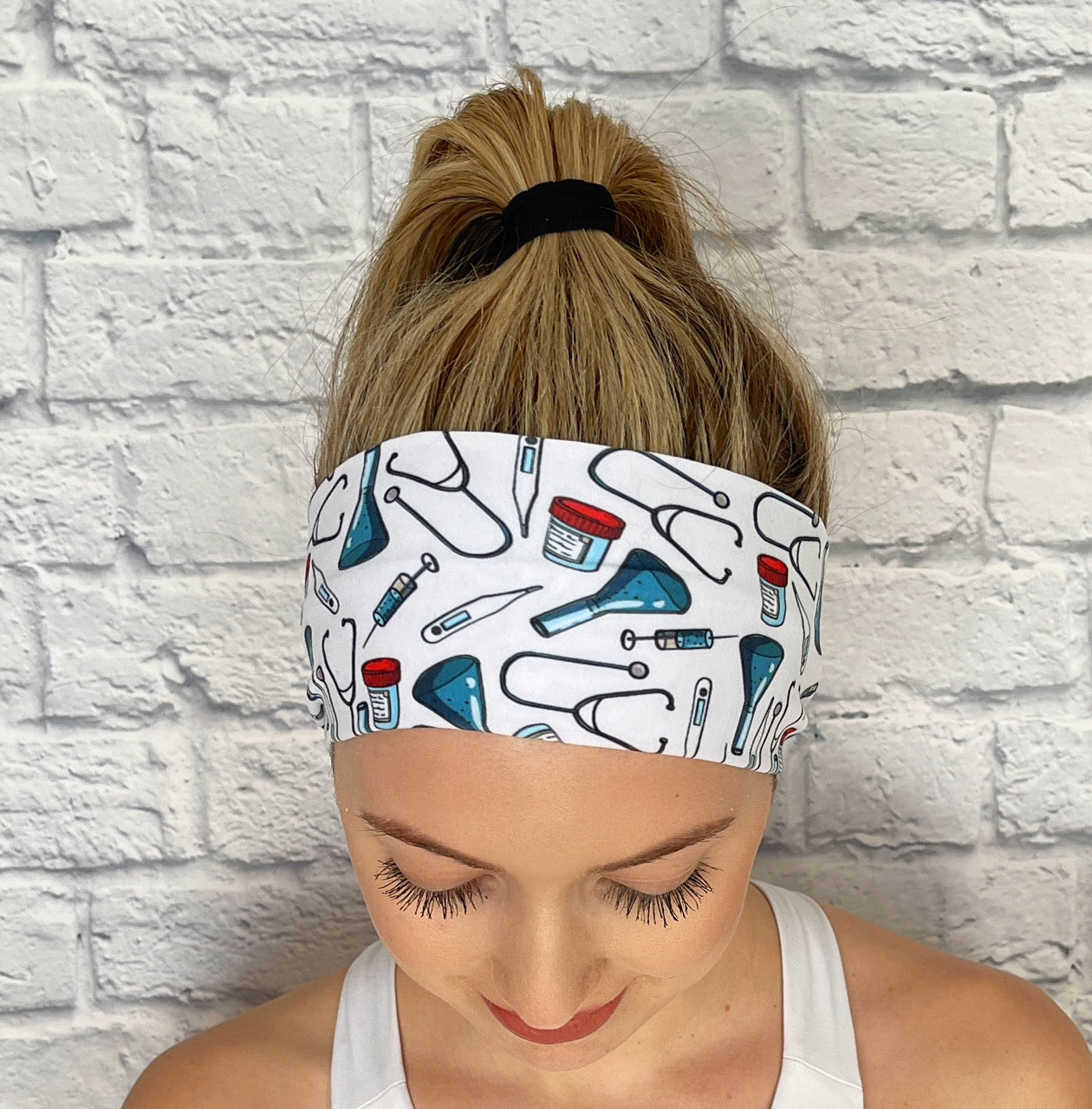 white  lab headband with blue beakers  and stethoscopes