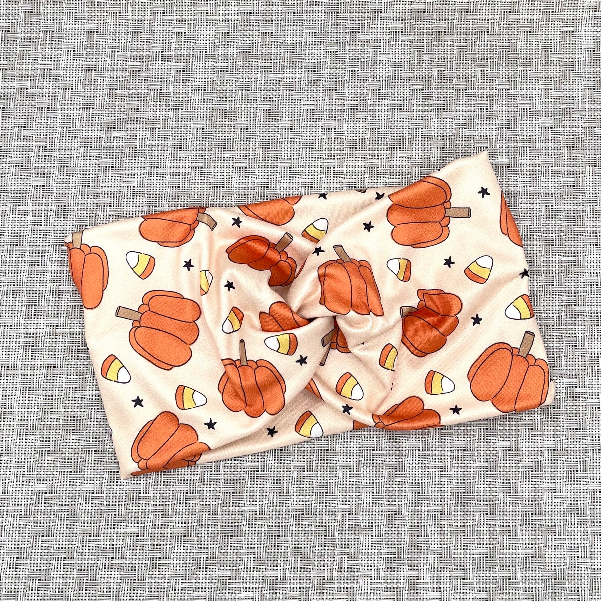 tan headband with pumpkins and candy corn