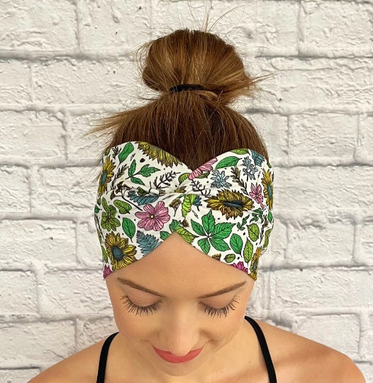 white headband with sunflowers, pink flowers, and leaves